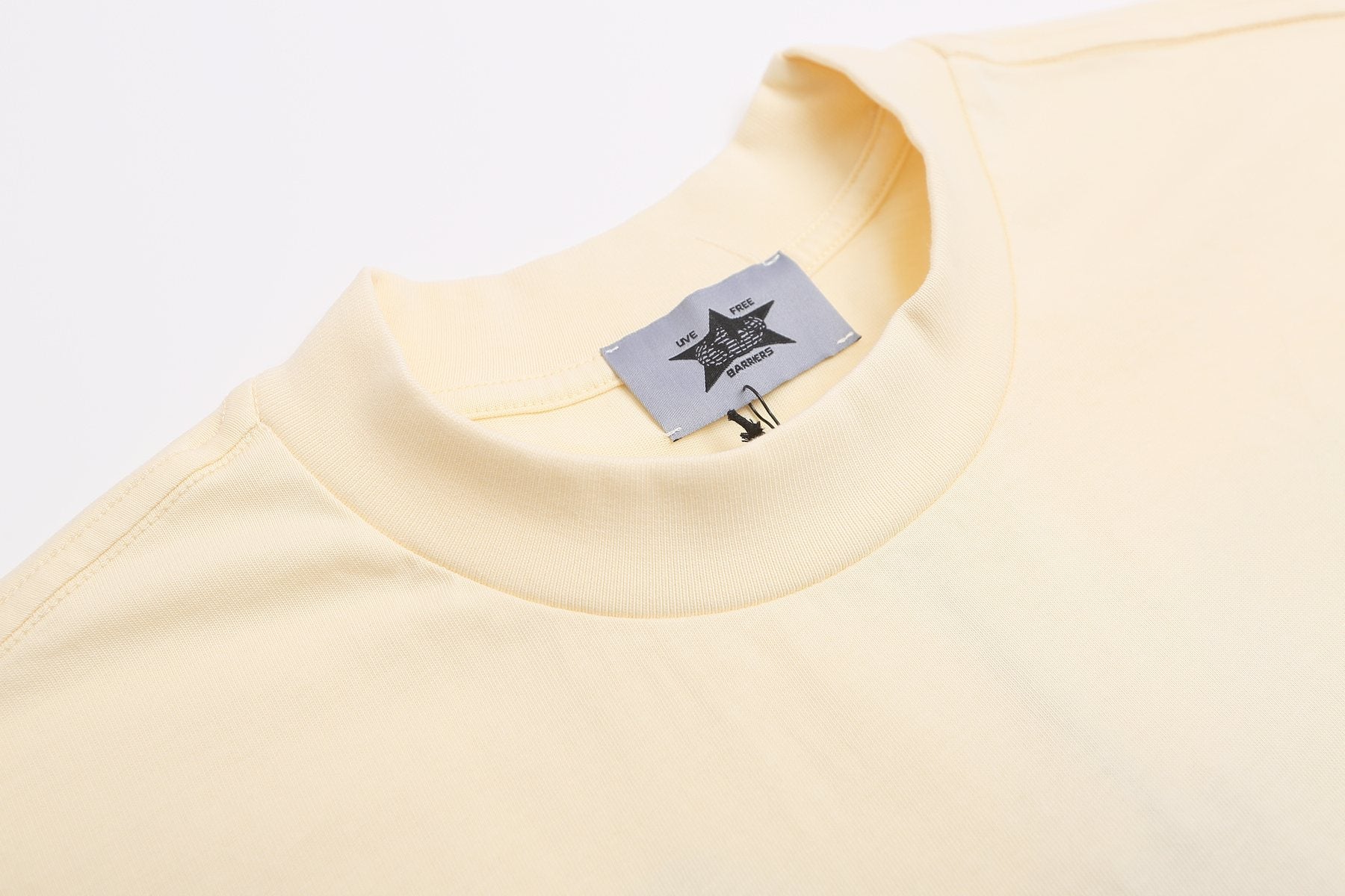 Fear of God x Barriers Cream Graphic T-Shirt — neck_label
