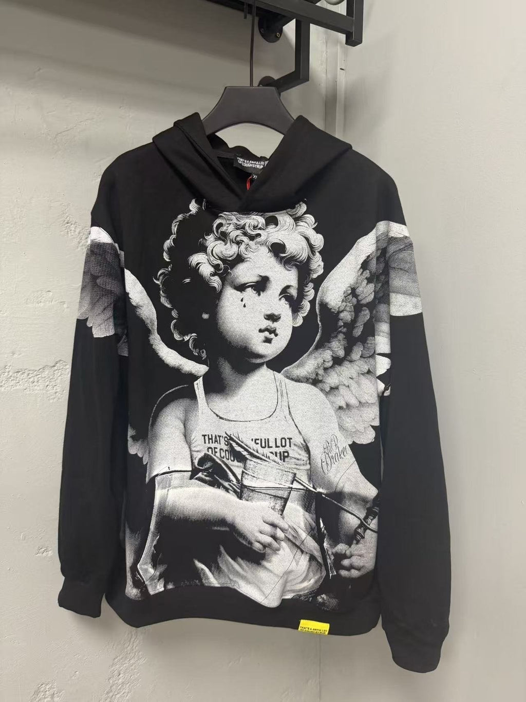 THAT'S A AWFUL LOT OF COUGH SYRUP Angel Tears Graphic Hoodie — front