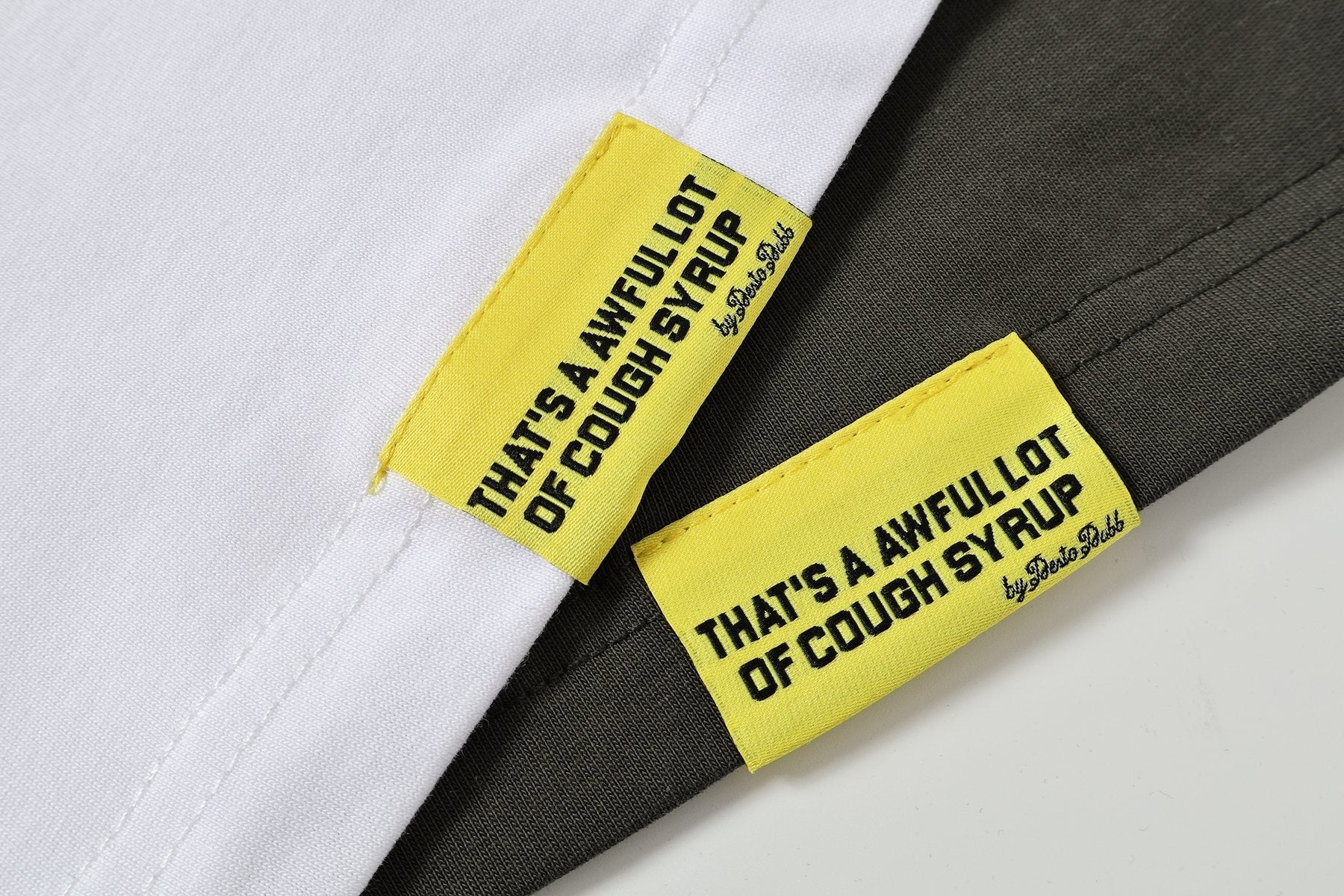 THAT'S A AWFUL LOT OF COUGH SYRUP Patch Graphic Short-Sleeve T-Shirt — fabric_closeup