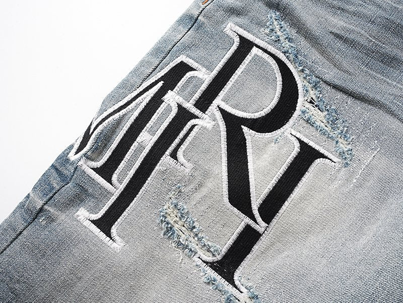 AMIRI Logo Graphic Light Blue Denim Shorts — detail