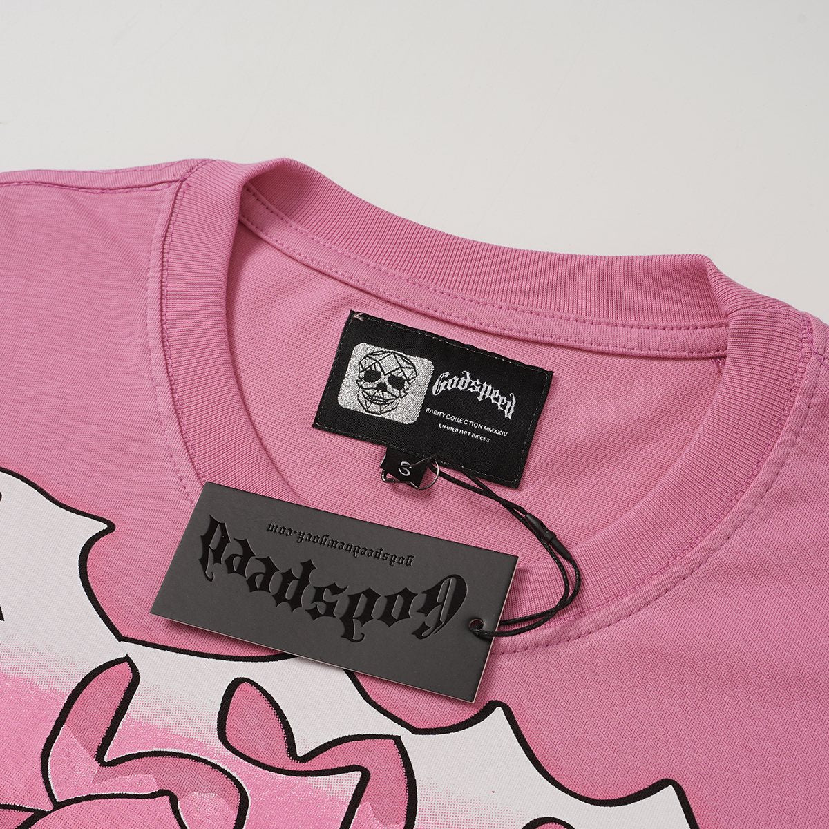 Godspeed Pink Graphic Short-Sleeve T-Shirt — hang_tag