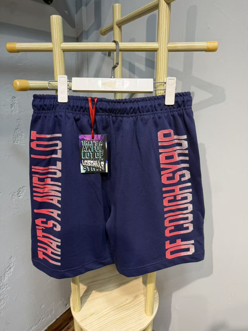 THAT'S A AWFUL LOT OF COUGH SYRUP Navy Graphic Shorts — back