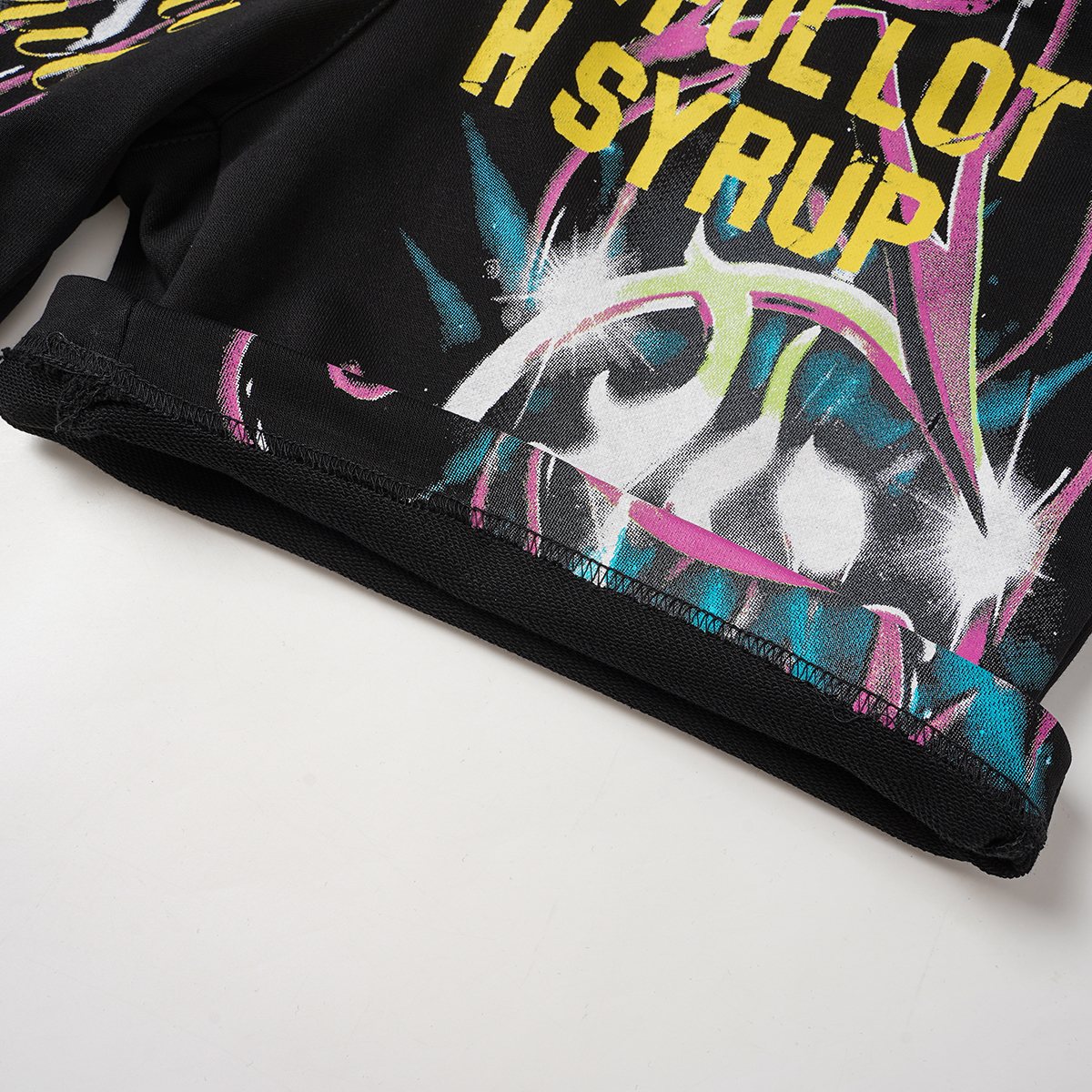 THAT'S A AWFUL LOT OF COUGH SYRUP Black Graphic Drawstring Shorts — detail