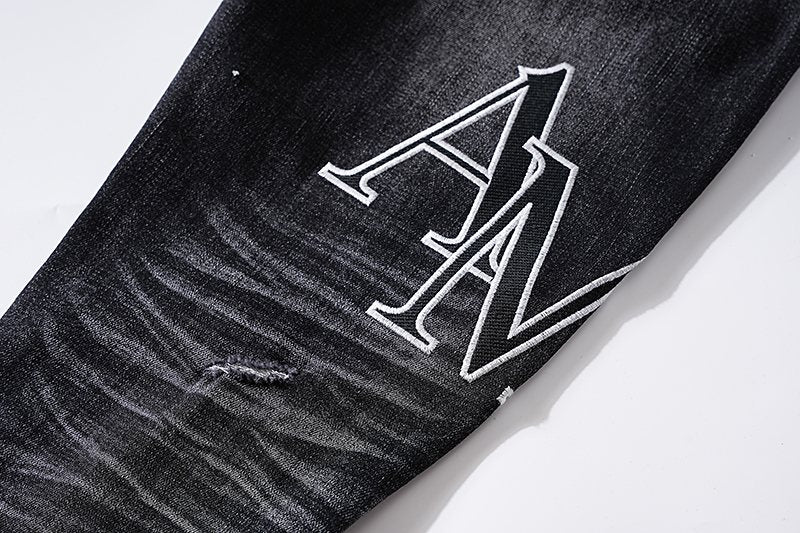 AMIRI Black Distressed Letter Graphic Jeans — detail
