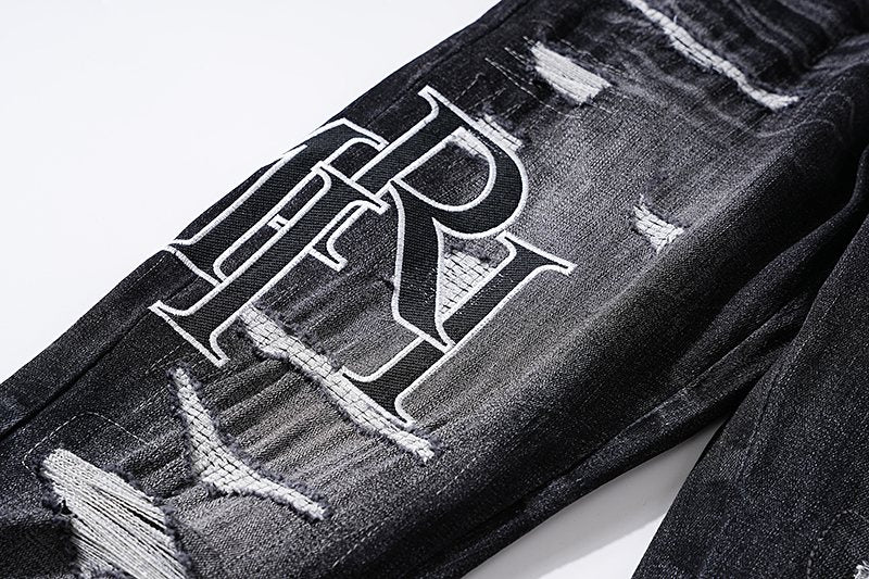 AMIRI Black Distressed Letter Graphic Jeans — detail