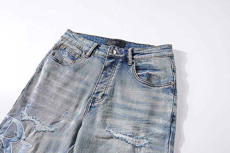 AMIRI Light Blue Letter Graphic Distressed Jeans — detail