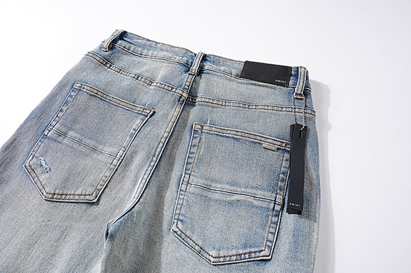 AMIRI Light Blue Letter Graphic Distressed Jeans — detail