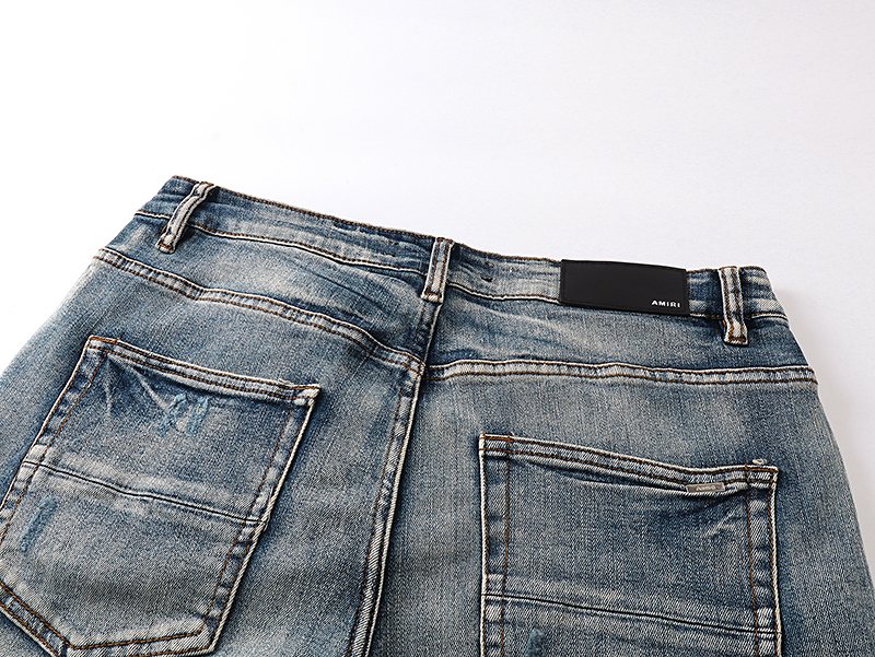 AMIRI Light Blue Distressed Letter Applique Jeans — detail