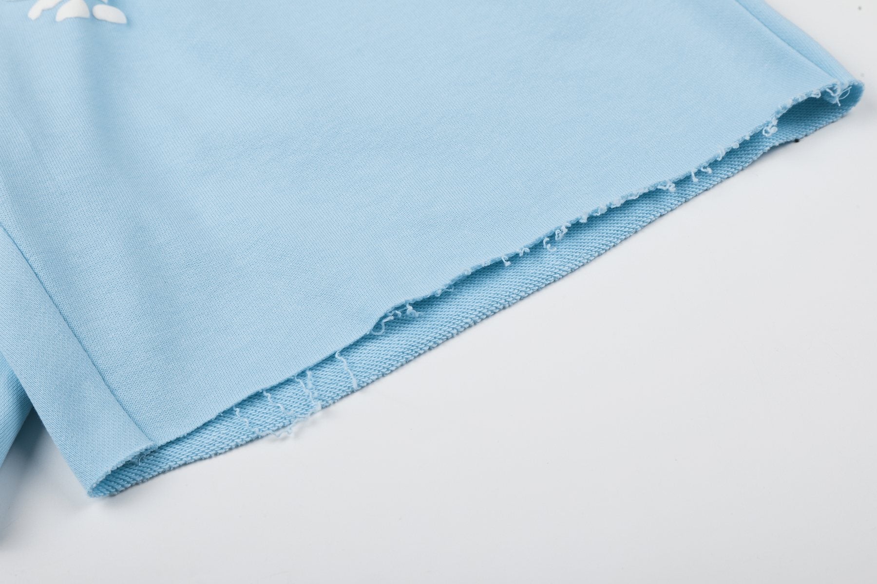 Sp5der Raised Graphic Raw Hem Shorts — detail