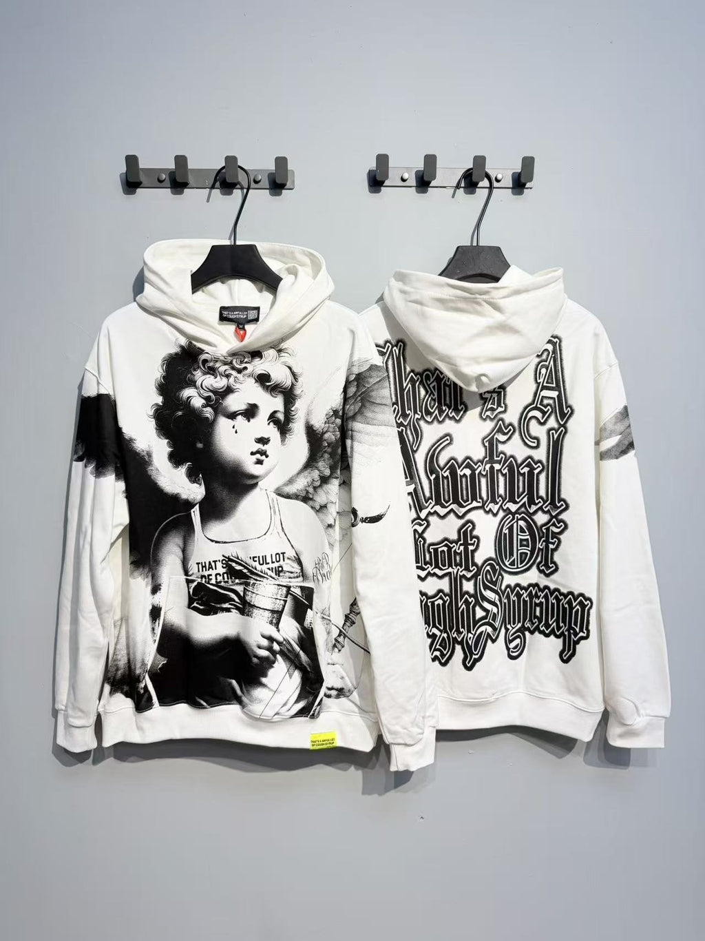 THAT'S A AWFUL LOT OF COUGH SYRUP Angel Graphic Hoodie — context