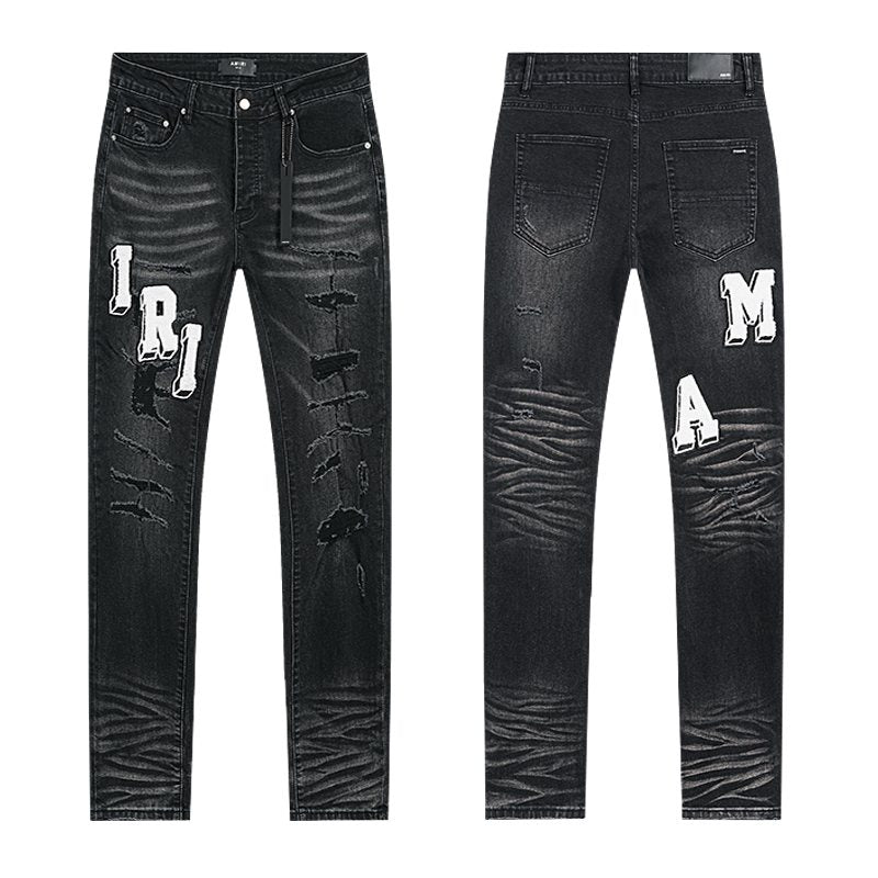 AMIRI Varsity Letter Appliqué Distressed Jeans — hero