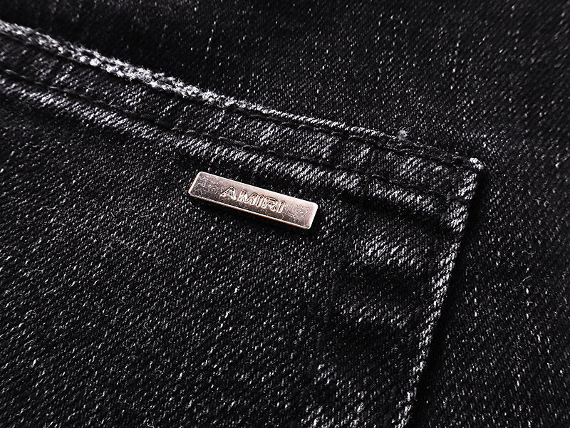 AMIRI Varsity Letter Appliqué Distressed Jeans — detail