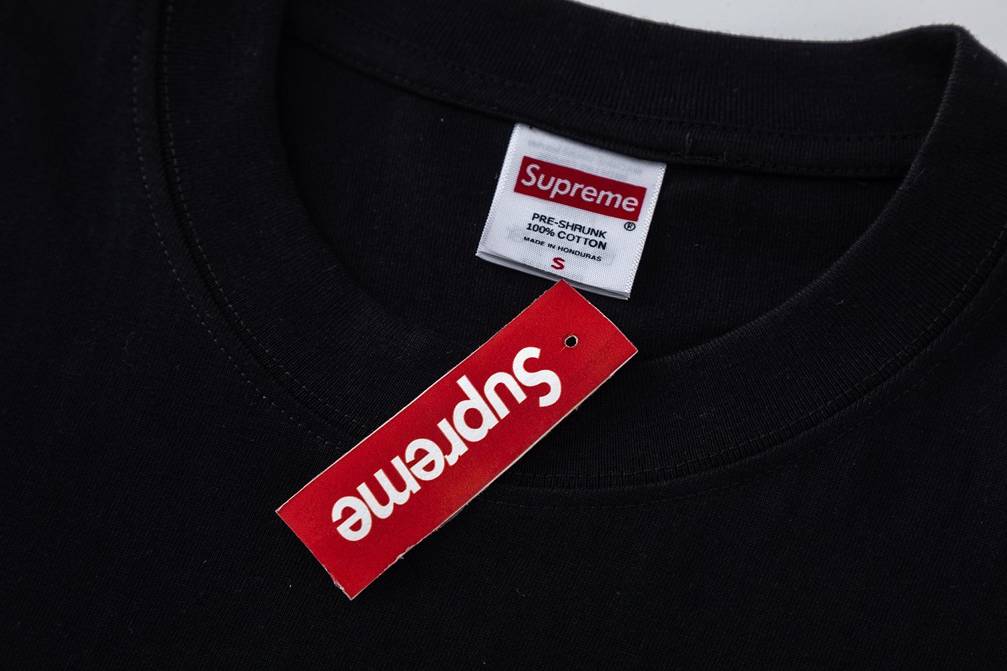 Supreme World Famous Arrow Graphic T-Shirt — hang_tag